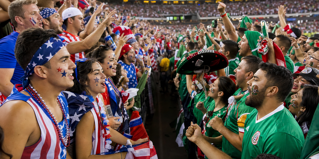 USA vs Mexico rivalry — fans from both nations facing off at a World Cup 2026 host city stadium